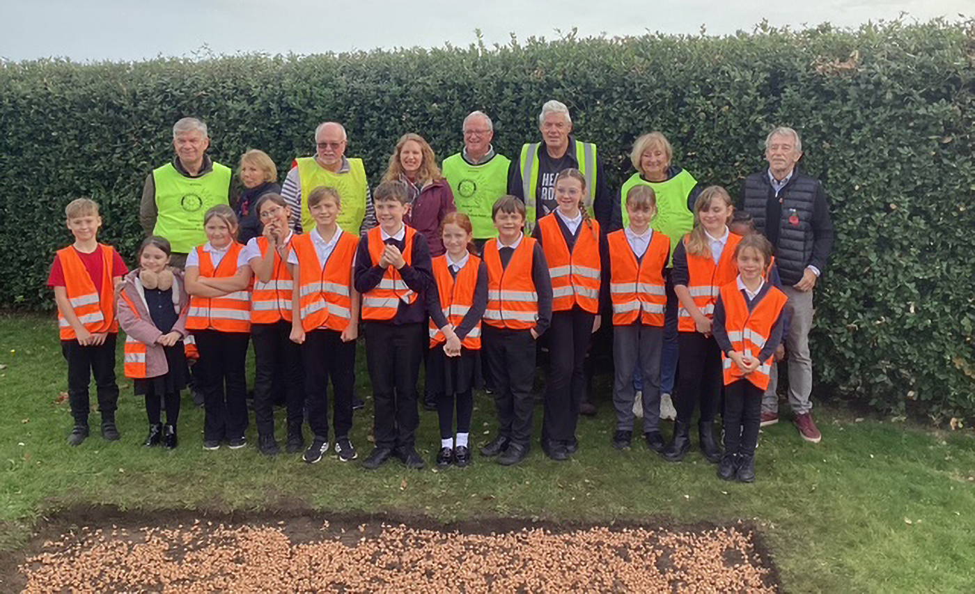 Calvin Sherwood presenting to East Point Rotary Club from behind an acrylic lecturn